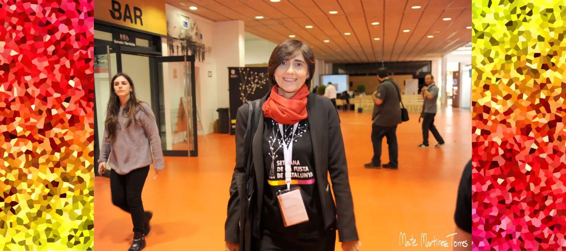 Maria Fernandez Alonso at a professional industrial fair, flanked by vibrant red and yellow textures, representing expertise in industrial event planning and business tourism.