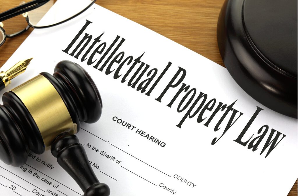 Legal deposit documents and a wooden judge’s gavel illustrating intellectual property law and heritage preservation.